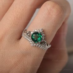 * The delicate ring displays lab emerald as main stone. The curved band beneath the gemstone makes the ring like an elegant crown. For who wearing this dainty ring, will shine like a queen. ◆ Production Description: Main stone Type: Lab Emerald Main Stone Shape: Round Cut Main Stone Size: 7*7mm Side stone: CZ Metal: 925 Sterling silver - Other options available in the drop down menu ◆ Customization: √Free for Add Engraving √Other Metal Type Available √Other Gemstones & Shapes Available √Pers Green Stone Rings For Women, Emerald Crown Queens, Elegant Green Solitaire Crystal Ring, Elegant Green Crystal Solitaire Ring, Elegant Solitaire Crystal Ring For May Birthstone, Elegant Emerald Birthstone Ring For May, Elegant Emerald Crystal Ring With Birthstone, Elegant Emerald Birthstone Ring Princess Cut, Elegant Emerald Birthstone Crystal Ring