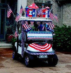 a golf cart decorated with american flags and decorations