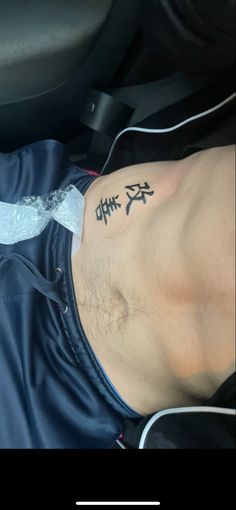 a man with chinese writing on his chest