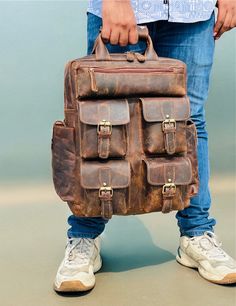 Adeeva Leather  Special offer Flat 70% Off With Free Shipping  ✍✍Free Personalization  Free Gift Wrapping Free Shipping 🔰 FEATURES: ◾ Unisex Backpack ◾ Made in Full-grain Leather, Excellent Quality ◾ Brown Vintage Color ◾ Padded pocket for laptop in the main compartment ◾ Antique Brass Hardware ◾ YKK Zippers ◾ 2 Pen Holder Slot ◾ Phone Holder and card Holder Slot ◾ Interior Zipper Pocket  ◾ Cotton Lining 🔦Material: Cowhide Genuine Leather 🔦Style: British Style, Gentry 🔦Capacity: Can hold a 14inch laptop, A4 book, folding umbrella, iPad, etc. 🔰🔰 Dimensions 🔰🔰 ◼ 16 Inches Height :- 16 Inches Length :- 12 Inches Width :-   5 Inches ◼ 18 Inches Height :- 18 Inches Length :- 13 Inches Width :-    6 Inches High Quality🤞 This handmade genuine leather bag is made from traditionally tanned Rectangular Leather Backpack For Outdoor Activities, Large Capacity Leather Backpack For Adventure, Large Capacity Rectangular Leather Backpack For Adventure, Handmade Leather Laptop Bag, Womens Rucksack, Leather Work Bag, Leather Backpack For Men, Timeless Bags, Travel Rucksack