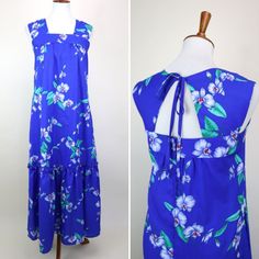 "A lovely Vintage Hawaiian dress with a stunning orchid in deep Blue print and sweet details. It features a tie keyhole back and wide straps, and is gathered above the bust for a loose shift fit. The hem reaches to about maxi length depending on personal stature and features a long ruffle. The fabric is a slightly slippery lightweight polyester weave, and the dress has a side zip entry and one side pocket. The perfect dress for those balmy nights and hot days during your week long getaway. GARMENT MEASUREMENTS (in Inches) Bust: 34\" Waist: 38\" Hip: 48\" Length: 53\" Estimated Best Fit: Size Small **all Measurements are taken with the garment lying flat, then doubled. Be sure to leave room for movement and comfort** CONDITION: VINTAGE EXCELLENT: Minimal wear and no flaws to make note of. L Vintage Hawaiian Dress, Blue Hawaiian, Hawaiian Dress, Vintage Hawaiian, Back Women, Maxi Robes, Summer Maxi Dress, Sundress, Dress Clothes For Women