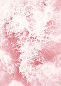 the water is pink and white as it looks like waves are crashing on top of each other