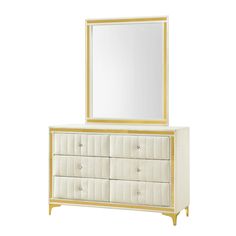 a white and gold dresser with a mirror on the top, and drawers below it