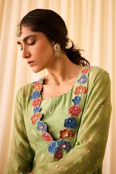 Green kurta with woven floral buttis, embellished by floral applique motifs and beads. Comes with palazzo, inner and dupatta. - Aza Fashions V-neck Anarkali Set With Resham Embroidery, Festive Green V-neck Sets, Festive V-neck Sets With Floral Embroidery, Green Floral Embroidery Anarkali Set, Green Anarkali Set With V-neck, Green V-neck Set For Diwali, Green Floral Embroidered Anarkali Set, Festive Green Tops With Dupatta, Festive Green Top With Dupatta