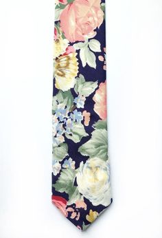 IMPORTANT SHIPPING INFO: Any orders made between Sat 27th July - Weds 7th August will not be shipped until after these dates due to holiday. Please get in touch if you have any further questions, I will be available to answer messages.DESCRIPTION: This lovely men's skinny tie has been handmade using a vintage navy/indigo cotton with a pink, yellow and blue rose print. FABRIC: Vintage Rose & Hubble cotton.LINING FABRIC: Cotton.------------------------------------------------------------------ Floral Print Ties For Spring Formal Events, Formal Floral Print Ties For Spring, Spring Floral Print Ties For Formal Occasions, Spring Floral Print Formal Ties, Formal Spring Floral Print Ties, Elegant Summer Floral Print Ties, Elegant Floral Print Summer Ties, Business Ties With Floral Print, Summer Formal Ties With Floral Print