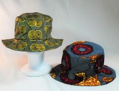 Fully reversible fedora shaped bucket hat. 22.5 inches 100% Cotton Hand wash or machine wash cold. Lay flat to dry Made in the USA Reversible Outdoor Bucket Hat With Flat Brim, Reversible Flat Brim Bucket Hat For Outdoor, Adjustable Reversible Yellow Bucket Hat, Adjustable Yellow Reversible Bucket Hat, Reversible Flat Brim Bucket Hat, Adjustable Reversible Yellow Sun Hat, Yellow Reversible Adjustable Sun Hat, Yellow Adjustable Reversible Sun Hat, Yellow Reversible Wide Brim Hat