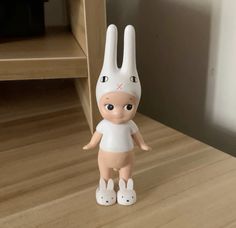 a toy rabbit is standing on the floor