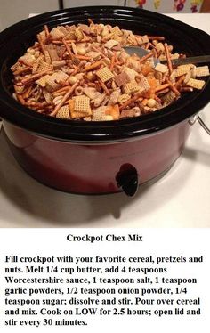 a crock pot filled with chex mix in it