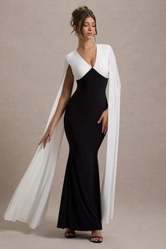 Defined by its timeless elegance and sophisticated details, Grace Kelly is a showstopping choice for your next special event. Crafted from our premium jersey, this black and white maxi dress features a daring plunge neckline that adds a touch of drama. The flowing cape sleeves evoke a sense of classic glamour, while the sleek silhouette ensures a flattering fit. Perfect for a formal evening or gala, let Grace Kelly shine with understated accessories and a chic updo for a look that embodies effortless grace and style.Features - Premium jersey- Plunge neckline - Long cape sleeve - Invisible zip closure- Maxi length Sizing & Fit Model is 5'7 and wears UK size 8 / US size 4 Product Information Designed exclusively by Club L London Partially lined with some stretch Premium jersey in Black and W Tight Long Dress, Plunge Neck Maxi Dress, Chic Updo, Flowy Bohemian Dresses, Black And White Maxi Dress, Trendy Maxi Dresses, Stylish Midi Dress, Stylish Maxi Dress, Black White Maxi Dress