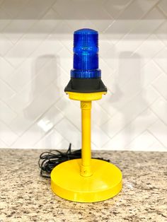 a blue light sitting on top of a counter