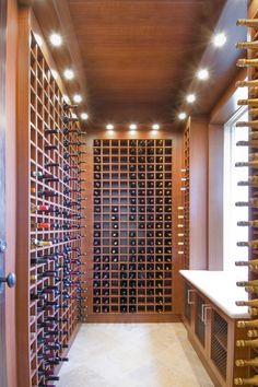 a wine cellar with lots of bottles in it