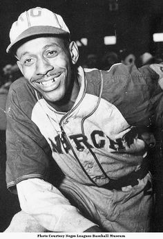 a black and white photo of a baseball player