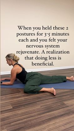 a woman is doing yoga on the floor with her back to the camera, and there is