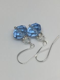 "12x10mm Light blue sapphire faceted crystal glass silver plated brass earrings the length with the hook is 1.25\". Hand made jewelry! All purchase will arrive in gifts boxes. Thanks for stopping by!" Nickel-free Blue Crystal Earrings For Formal Occasions, Elegant Blue Crystal Earrings With Faceted Beads, Blue Sterling Silver Earrings With French Hook, Sterling Silver Blue French Hook Earrings, Elegant Blue Faceted Crystal Earrings, Nickel Free Blue Crystal Earrings, Nickel-free Blue Crystal Earrings, Blue Crystal Earrings With Ear Wire For Formal Occasions, Blue French Hook Jewelry As Gift