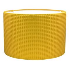 a yellow round lamp shade on a white background