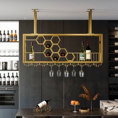 a wine rack with bottles and glasses hanging from it