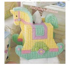 a crocheted toy horse that is sitting on a table