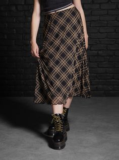 Mix up your plaid skirt rotation with this midi style. It has a mesh overlay printed with black and brown plaid. It's fully lined with an elastic waistband.95% polyester; 5% spandexWash cold; dry lowLength: 29''ImportedListed in junior sizes Houska Castle, Social Collision, Skirts Hot, Stil Emo, Plaid Midi Skirt, Tall Hoodies, Plus Size Fits, Alt Fashion, Mesh Overlay