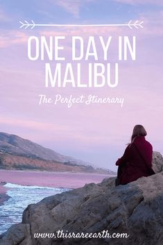 a woman sitting on top of a rock near the ocean with text overlay that reads one day in malbu