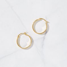 These are the perfect balance of statement and minimalist. They are chic and the perfect size hoops to take you from day to night. Very lightweight and comfortable! Made of 925 Sterling Silver We use a THICK plating of 14k Gold or Rhodium Nickel-free & Hypoallergenic Inner Diameter: 18mm Thickness: 4.6mm Also available in 22mm and 28mm Hoop Sizes Earrings Small Hoop, Thick Gold Hoops, Earrings Gold Hoop, Dainty Hoop Earrings, Chunky Hoop Earrings, Small Hoop Earrings, Tiny Diamond, Sterling Silver Hoops, Gold Hoops