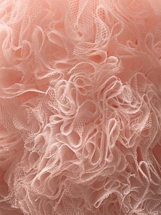 close up view of pink fabric with white lace