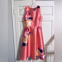 Nwt Moon Collection Peach Floral Dress Size Medium Never Worn Material Is Sturdy And Glossy Purchased From Shoptiques For A Wedding But Didn’t Fit Peach Sleeveless Midi Dress With Floral Print, Sleeveless Peach Midi Dress With Floral Print, Peach Floral Dress, Moon Collection, Fit N Flare Dress, Orange Pink, Pink Orange, Fit & Flare, Trending Accessories