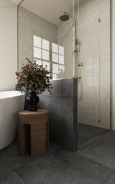 a bathroom with a tub, sink and shower head in the corner next to it