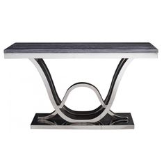 a black and white marble table with metal accents on the base, against a white background