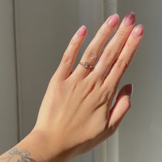 a woman's hand with a ring on it