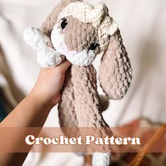 a hand holding a crochet stuffed animal with the words crochet pattern below it