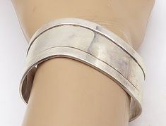 "925 Sterling Silver - Vintage Shiny Wavy Raised Edge Cuff Bracelet - BT2564  925 Sterling Silver - Vintage Shiny Wavy Raised Edge Cuff Bracelet - BT2564  Jewelry Type:         Bracelet   Metal Type:            925 Silver  Metal Size:             2.25\"  Diameter  1\" Height   Stone Type:            N/A  Condition:              N/A  Jewelry Weight:     50.8 Grams  PLEASE NOTE: THIS ITEM IS PRE-OWNED. ALTHOUGH MOST ITEMS ARE IN VERY GOOD CONDITION, SOME MAY NEED CLEANING AND/OR MINOR REPAIRS. WE Bracelet Metal, Metal Bracelets, Cuff Bracelet, Types Of Metal, Metallic Silver, 925 Silver, Jewelry Bracelets, Size 2, 925 Sterling Silver