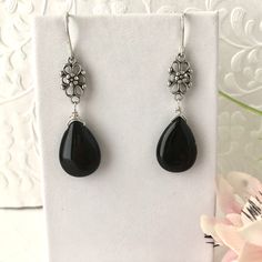 Timeless earrings made of solid black agate and antiqued sterling silver filigree components. Elegant Adjustable Nickel-free Teardrop Earrings, Elegant Black Drop Jewelry, Elegant Pierced Teardrop Earrings With Adjustable Fit, Classic Black Drop Jewelry, Black Drop Jewelry With Pierced Details, Black Drop-shaped Pierced Jewelry, Black Sterling Silver Long Drop Jewelry, Black Drop Earrings For Formal Occasions, Elegant Onyx Drop Jewelry