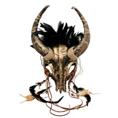 an animal skull with horns and feathers on it's head