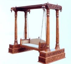 a wooden swing bed with chains hanging from it's sides and an ottoman underneath