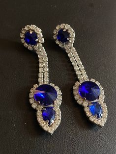 Vintage Czech Rhinestone SAPPHIRE BLUE and Clear Glass Paste Diamante Chandelier Dropper Drop pierced  Earrings Christmas  Genuine Old Shop Stock Sourced from Czechoslovakia from the town of Jablonec , home of the Czech bijouterie making tradition. Made in Czech recently from old shop stock fittings  - not reverse of earrings show age/tarnish/soldering - fronts are perfect!  Great for the Christmas Parties! Blue Jeweled Crystal Jewelry, Blue Crystal Jeweled Jewelry, Royal Blue Crystal Jewelry For Party, Formal Blue Crystal Earrings, Glamorous Blue Jewelry For Formal Occasions, Glamorous Blue Jewelry For Formal Events, Glamorous Blue Formal Jewelry, Elegant Jeweled Blue Crystal Earrings, Party Jewelry With Handset Crystal Stones