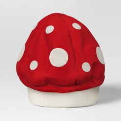 a red and white hat with polka dots on it