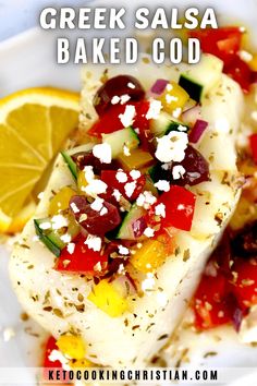 greek salad baked in the oven with lemons, olives, tomatoes and feta cheese