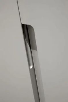 a knife sticking out of the side of a refrigerator