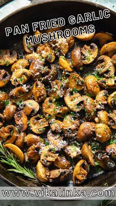 a skillet filled with mushrooms and herbs