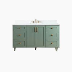 a green bathroom vanity with two sinks and gold pulls on the cabinet doors, against a white background