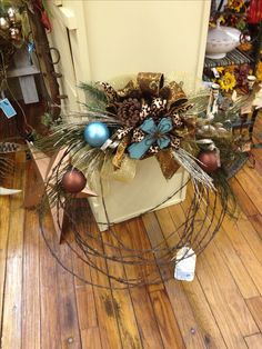 a christmas wreath on top of a wooden floor