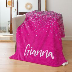 a pink blanket with the word giana printed on it in white letters and stars