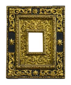 an ornate gold and black frame on a white background