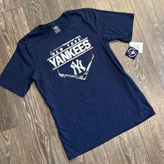 Nwt Yankee Baseball T Shirt Navy Graphic Tee For Sports, Navy Graphic Print Fan Apparel Top, Navy Graphic Tee For Fan Merchandise, Navy Graphic Tee With Graphic Print, Navy Pre-shrunk Tops For Fan Merchandise, Navy Short Sleeve Fan Merchandise Top, Navy Short Sleeve Fan Apparel Top, Navy Short Sleeve Top For Fan Apparel, Yankees Baseball