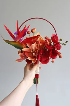 chinese wedding bouquet circular fan bouquet burgundy red chinese traditional artificial tropical flowers fall wedding bridal bouquet Chinese Wedding Flowers, Red And Yellow Wedding, Red And Orange Wedding, Yellow Wedding Decor, Orange Wedding Decor, Chinese Orchid, Red Flower Arrangements, Yellow Wedding Decorations, Orange Wedding Decorations