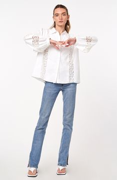 This classic cotton shirt is sweetly updated with lacy accents and charming circle trim. 24 1/2" length Front button closure Spread collar Long sleeves with button cuffs 100% cotton Hand wash, dry flat Imported Asian & Pacific Islander Owned/Founded Spring Button-up Top With Lace Cuffs, White Button-up Tops With Lace Cuffs, White Lace Cuffs Button-up Tops, Spring Lace Collar Button-up Shirt, Spring Lace Trim Button-up Shirt, Classic Long Sleeve Shirt With Lace Trim, Spring Long Sleeve Shirt With Lace Trim, Cotton Blouse With Broderie Anglaise In Relaxed Fit, Spring Collared Blouse With Lace Cuffs