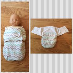 a baby doll laying on top of a wooden floor next to a cloth diaper