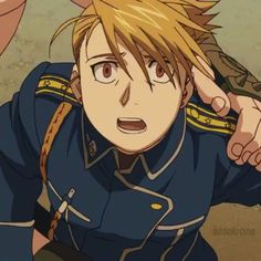 an anime character with blonde hair and blue uniform holding his hand up to his ear