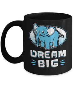 a black coffee mug with an elephant and the words dream big in blue on it