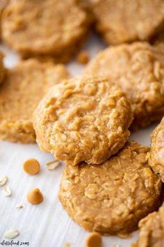 peanut butter oatmeal cookies stacked on top of each other with one cookie in the middle